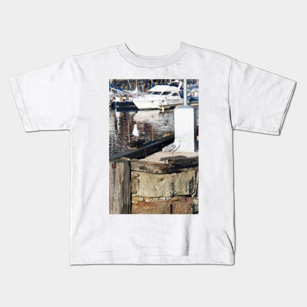 Scarborough Seagulls resting on the harbour wall, Yorkshire, UK Kids T-Shirt by richflintphoto